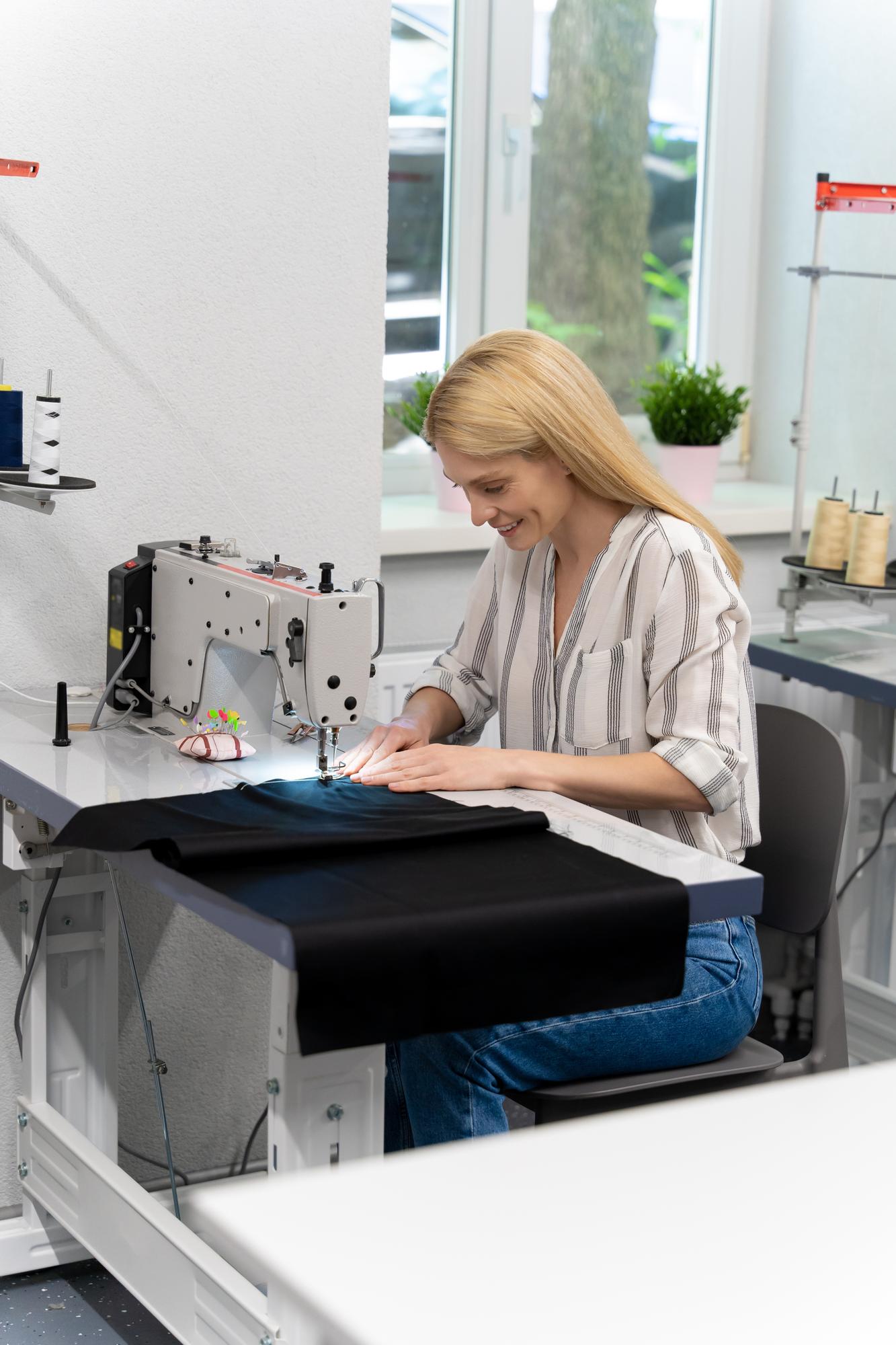 atelier workspace with embroidery machine and threads