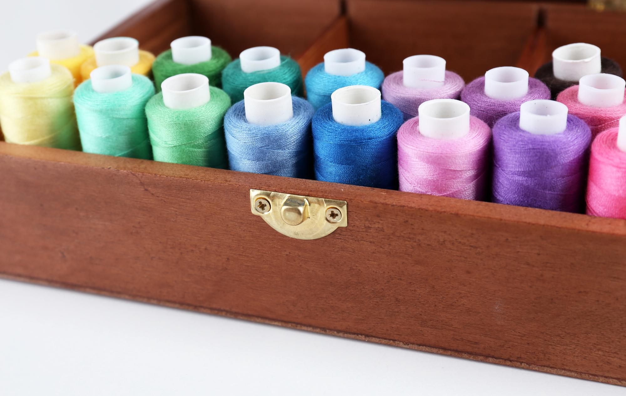 selection of embroidered samples arranged on table